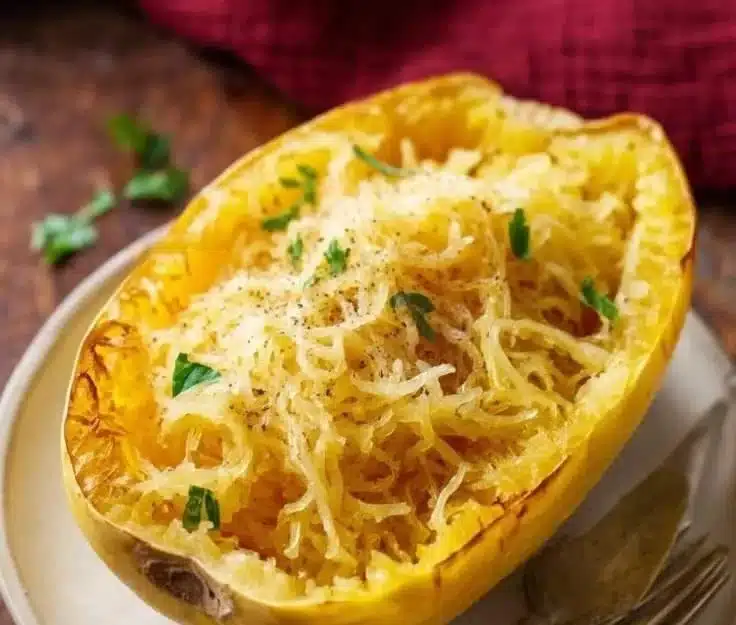 Healthy spaghetti squash dish with fresh ingredients and herbs